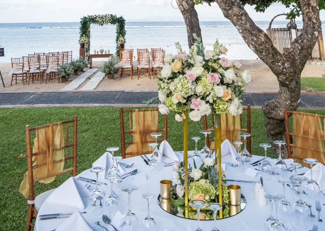 destination wedding on the beach with dining off to the side