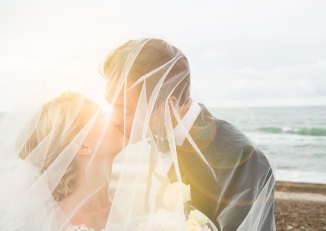 newly married couple kissing