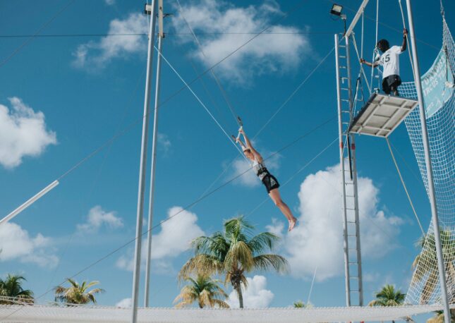 Bring out your inner child and try the trapeze.