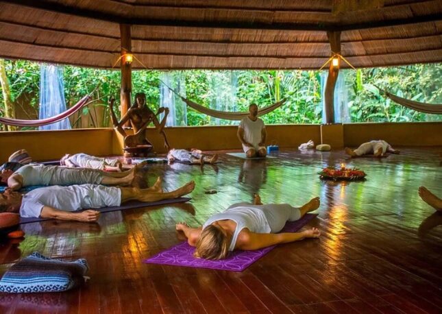 Enjoying the sounds of nature during a rain forest yoga class
